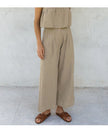 Women’s linen cropped culotte trousers by FJØRNA featuring wide-leg design and lightweight, breathable fabric.