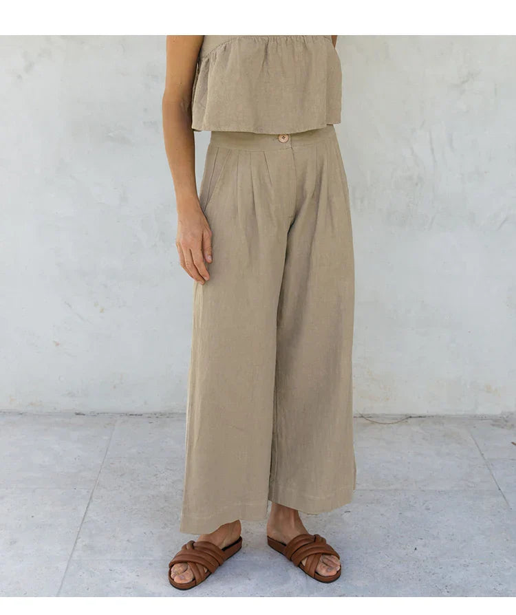 Women’s linen cropped culotte trousers by FJØRNA featuring wide-leg design and lightweight, breathable fabric.