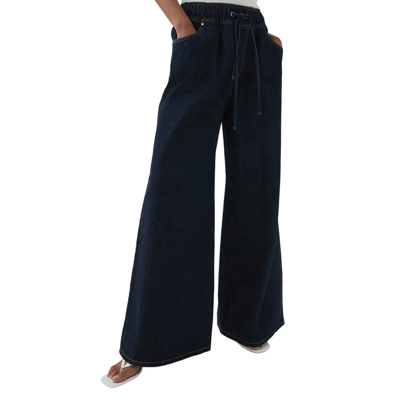 Blue denim wide-leg drawstring jeans for women by FJØRNA, relaxed fit pants with a casual, comfortable style.