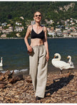 FJØRNA knit wide leg women’s trousers with drawstring waist, soft fabric, and relaxed fit, shown on a model.