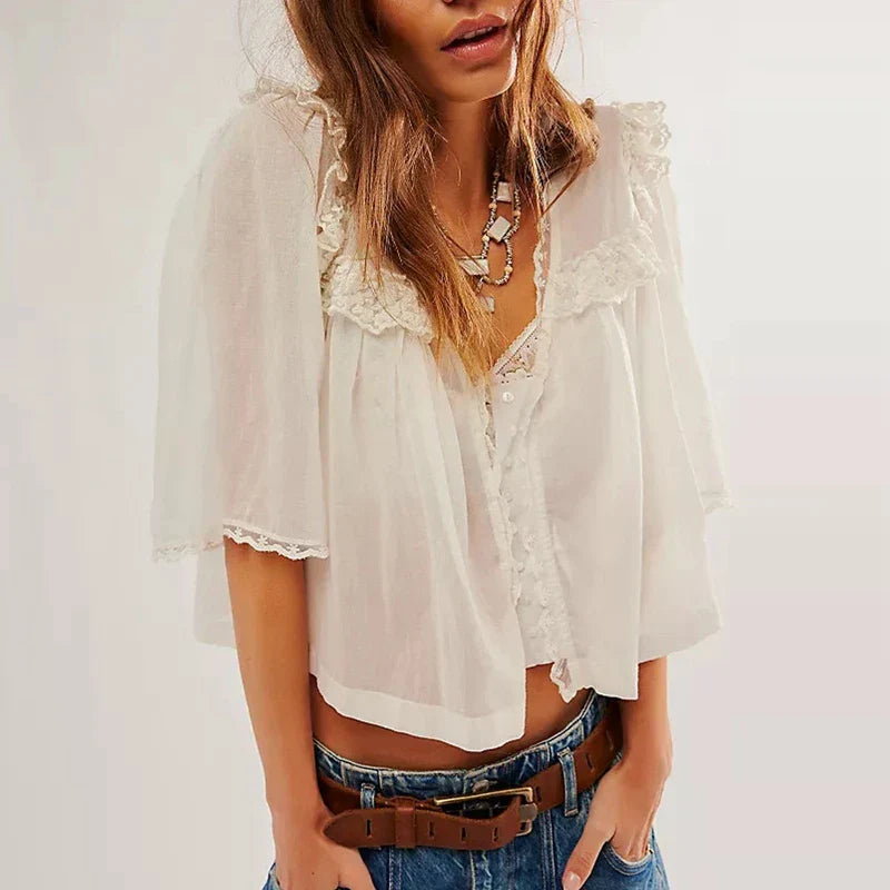 FJØRNA white cropped cotton blouse with lace trim, stylish women’s top featuring delicate lace details and a comfortable fit.