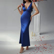 FJØRNA elegant women's midi dress with v-neck, sleeveless design, flowy fabric, suitable for stylish occasions.