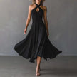 FJØRNA Josie Flowy A-Line Maxi Dress in white, lightweight and elegant, with a fitted bodice and flowing skirt, perfect for summer.