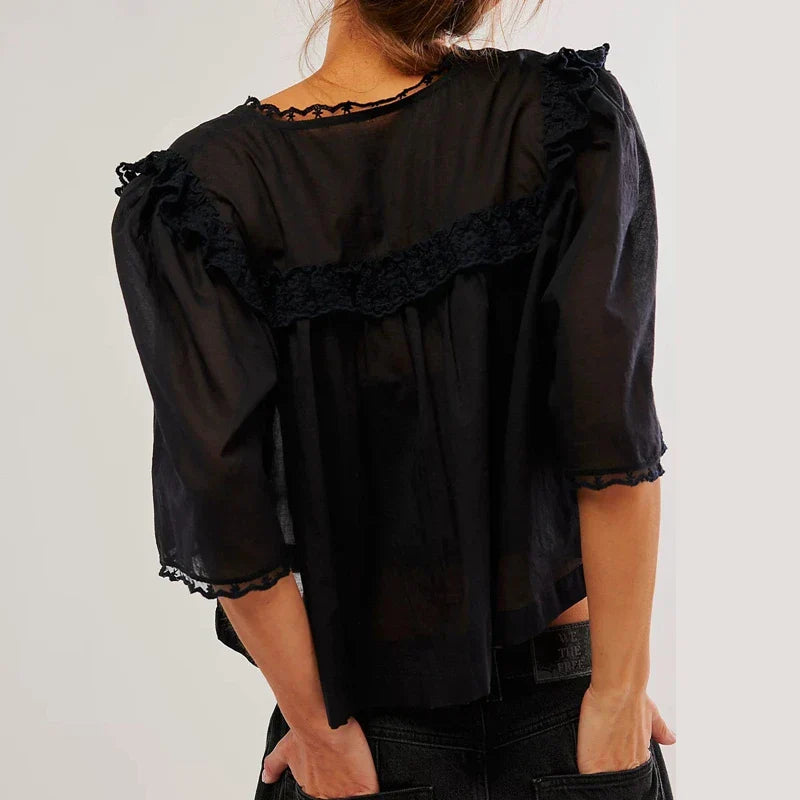 Cream cropped cotton blouse with lace trim, women's FJØRNA top featuring a stylish design and feminine details.
