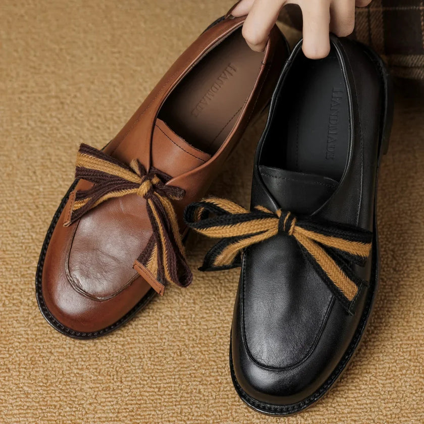 Women's FJØRNA dual-tone leather loafers featuring handcrafted design and cushioned insoles for comfortable style.