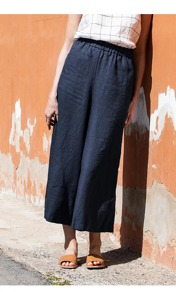 FJØRNA linen wide leg women's trousers with drawstring waistband, pull-on style, soft and breathable fabric, relaxed fit.