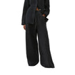 Blue denim wide-leg drawstring jeans for women by FJØRNA, relaxed fit pants with a comfortable waistband.