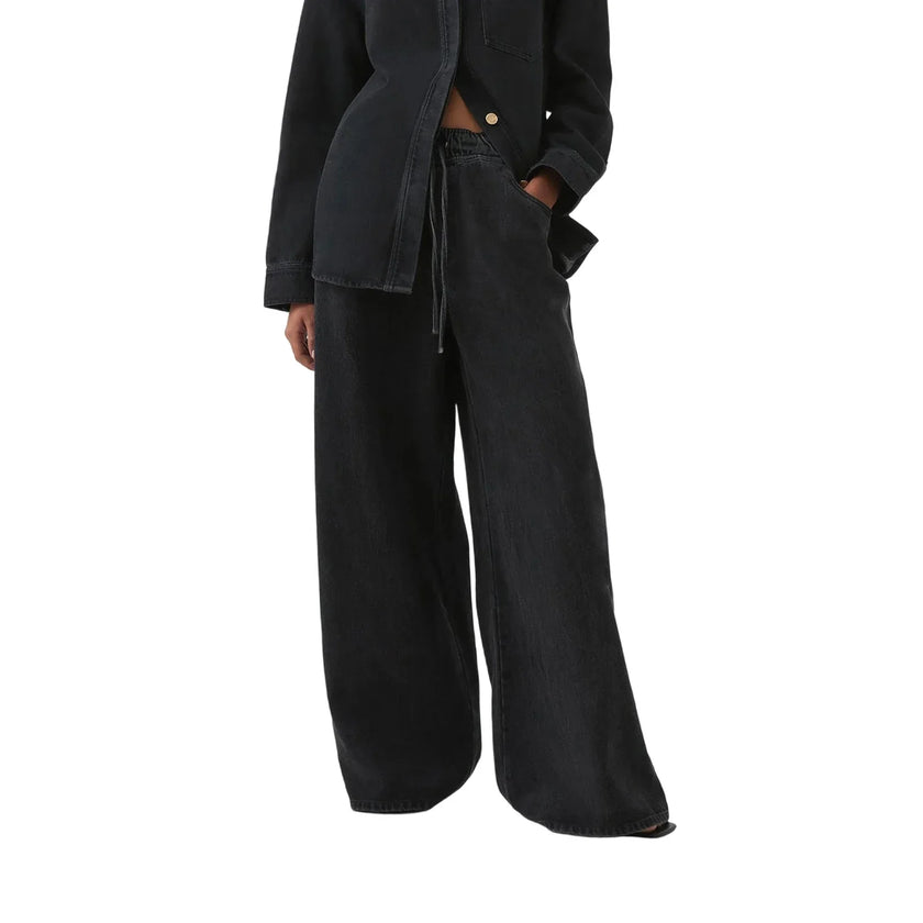 Blue denim wide-leg drawstring jeans for women by FJØRNA, relaxed fit pants with a comfortable waistband.