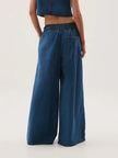 Blue denim wide-leg drawstring women's jeans by FJØRNA, relaxed fit pants with a casual, comfortable style.