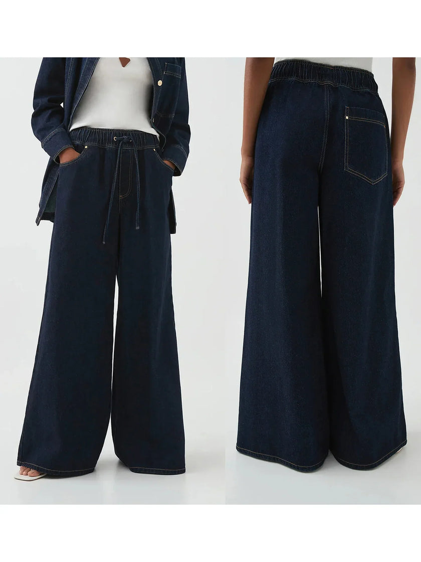 Blue denim wide-leg drawstring jeans for women by FJØRNA, showcasing relaxed fit and stylish design.