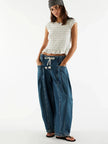 FJØRNA women's cotton wide-leg drawstring jeans with relaxed fit and stylish design, shown in a natural stance.