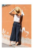 FJØRNA linen wide-leg trousers for women with drawstring pull-on design, showcasing relaxed fit and lightweight fabric.