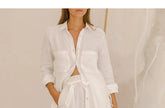 FJØRNA linen wide-leg trousers for women, loose pull-on pants, showing the relaxed fit and lightweight fabric.