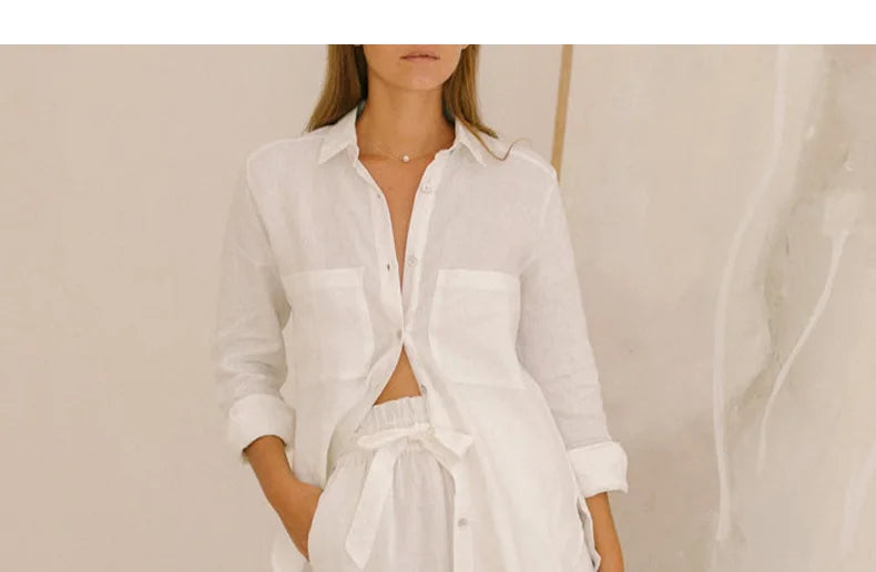 FJØRNA linen wide-leg trousers for women, loose pull-on pants, showing the relaxed fit and lightweight fabric.