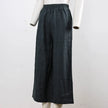 FJØRNA women's linen wide-leg trousers with drawstring, pull-on style, featuring a relaxed fit and lightweight fabric.