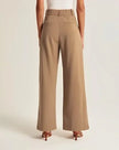 White wide-leg high-waist trousers for women by FJØRNA, featuring a stylish high-waist design and relaxed wide-leg fit.