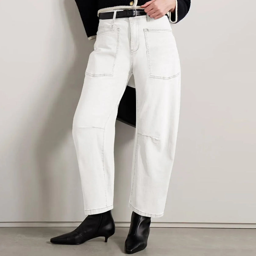FJØRNA women's denim jeans with barrel leg style, showcasing a classic fit and durable indigo denim fabric.