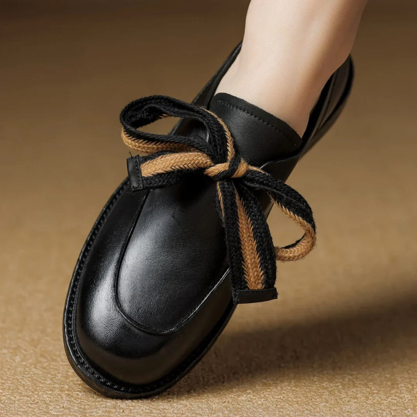 FJØRNA women's dual-tone leather loafers with handcrafted design and cushioned soles, stylish and comfortable for everyday wear.