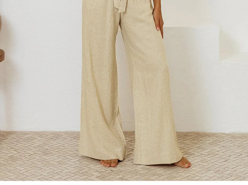 FJØRNA linen wide-leg women's trousers, loose pull-on pants with a relaxed fit and natural fabric texture.