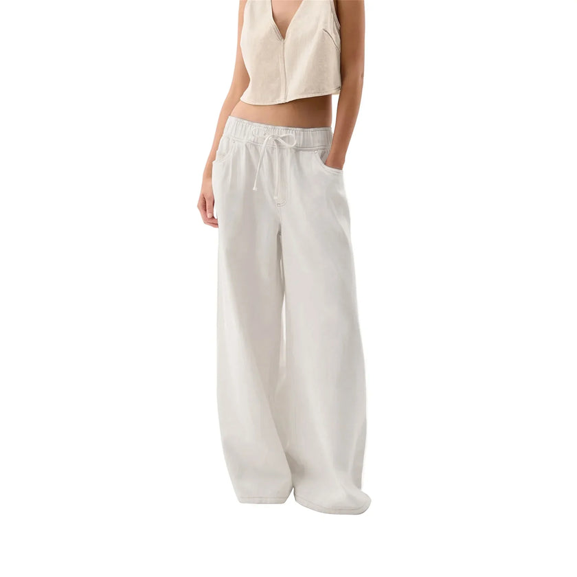 Blue denim wide-leg drawstring women's jeans by FJØRNA, relaxed fit pants with a casual, comfortable style.