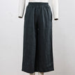 FJØRNA women's linen wide-leg trousers with drawstring pull-on design, relaxed fit, and lightweight fabric.