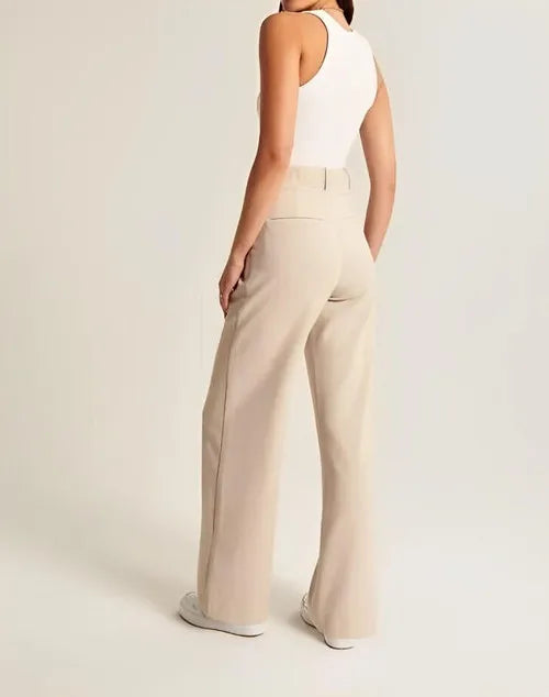 White wide-leg high-waist trousers for women by FJØRNA, featuring a relaxed fit and elegant high-rise design.