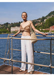 FJØRNA women's knit wide-leg trousers with drawstring waist, soft fabric, and relaxed fit, shown on a model.