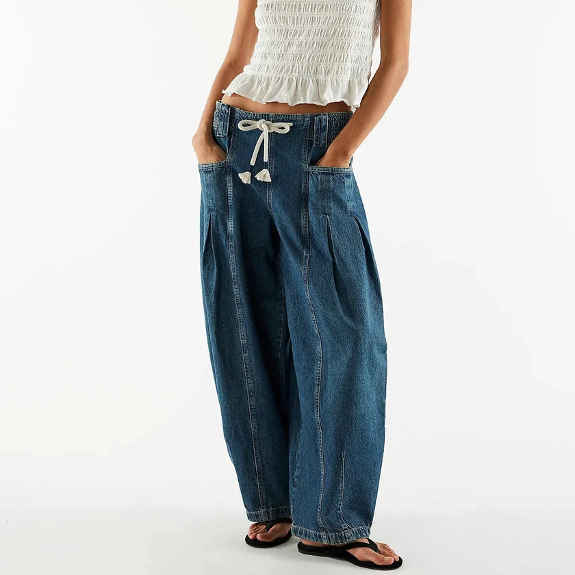 Women’s wide-leg cotton jeans by FJØRNA with drawstring waist, casual stylish pants, visible in the image.