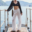 FJØRNA women's knit wide leg trousers with drawstring waist, soft fabric, and relaxed fit, perfect for casual or comfortable wear.