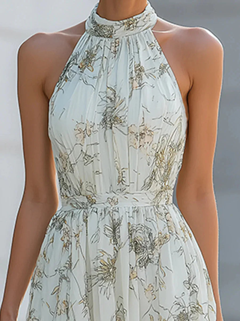 FJØRNA Fiona Flowy Halter Maxi Dress in white, sleeveless with a flowing fabric and halter neckline, perfect for summer events.