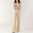 FJØRNA women's merino wool joggers with wide-leg design, soft textured knit pants for comfortable casual wear.