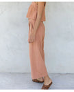 Women’s wide-leg linen cropped culotte trousers by FJØRNA, showcasing lightweight, breathable fabric and relaxed fit.
