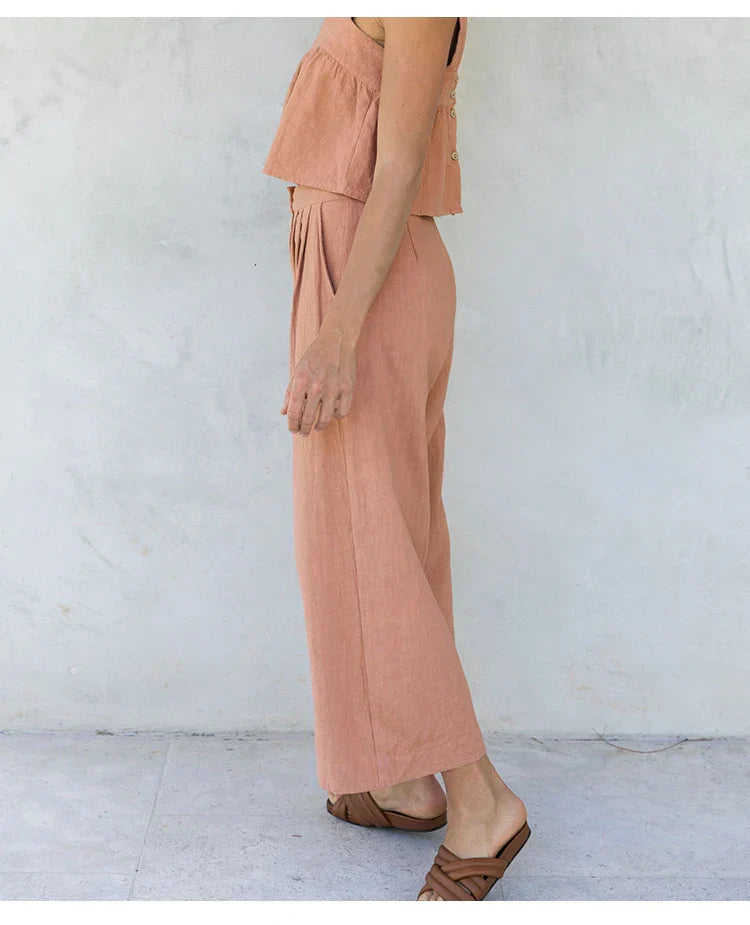Women’s wide-leg linen cropped culotte trousers by FJØRNA, showcasing lightweight, breathable fabric and relaxed fit.