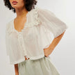 White cream cropped cotton blouse with lace trim, women's FJØRNA top featuring delicate details and a stylish fit.