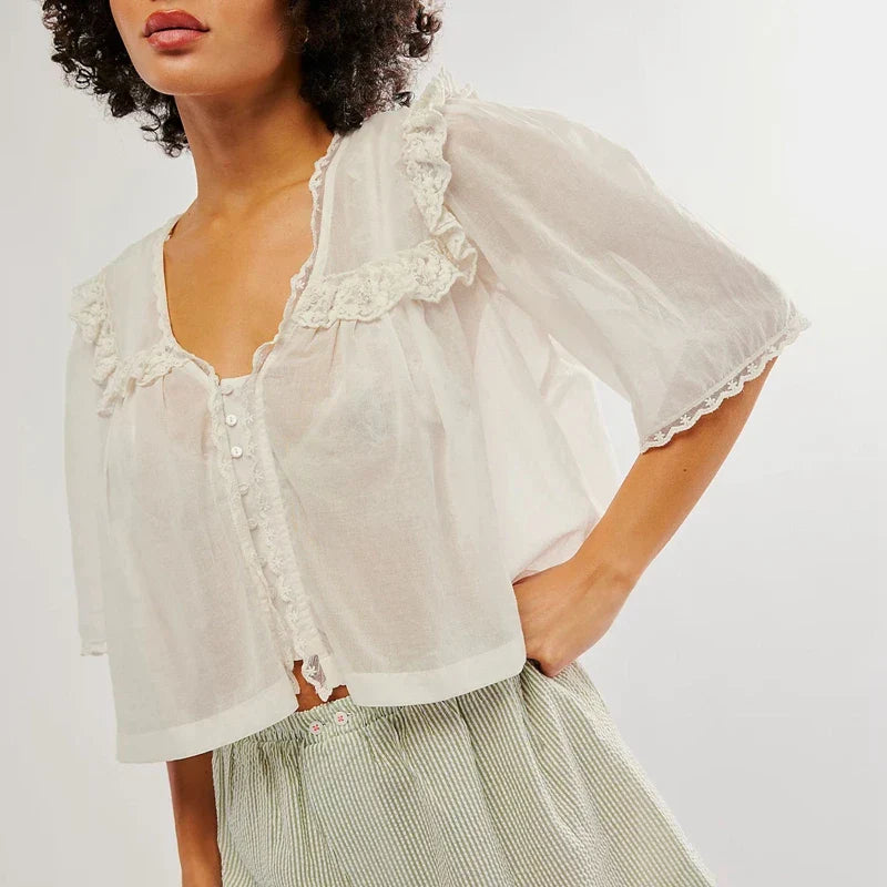 White cream cropped cotton blouse with lace trim, women's FJØRNA top featuring delicate details and a stylish fit.