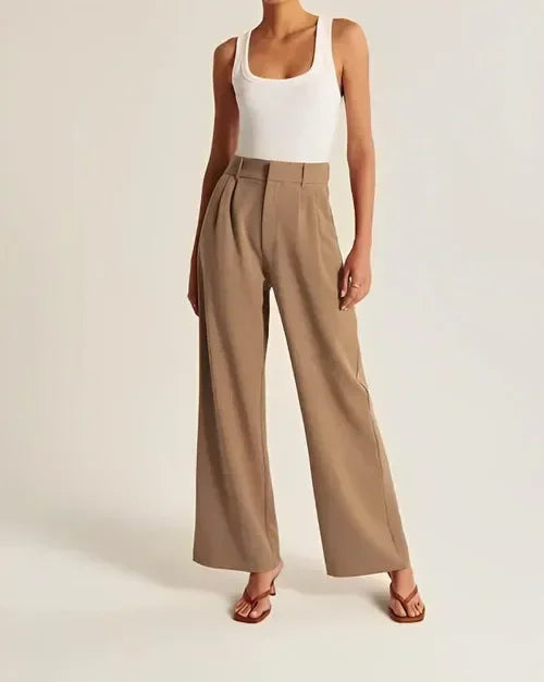 White wide-leg high-waist women's trousers by FJØRNA, featuring a relaxed fit and tailored high waist for a stylish look.