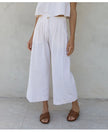 FJØRNA women's linen cropped culotte trousers with wide-leg design, lightweight and breathable for a relaxed, stylish look.