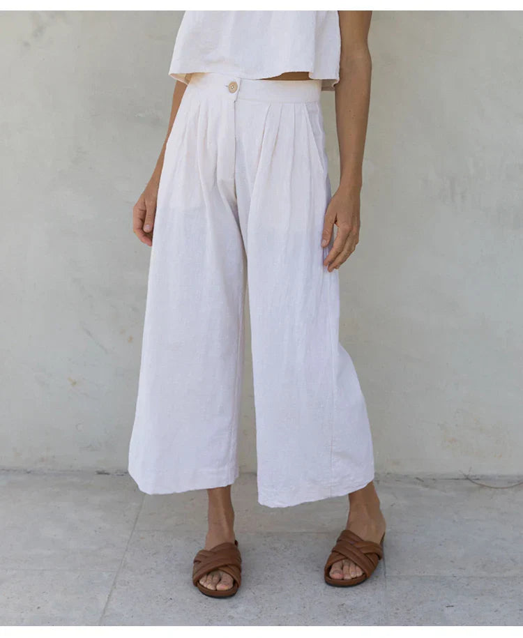 FJØRNA women's linen cropped culotte trousers with wide-leg design, lightweight and breathable for a relaxed, stylish look.