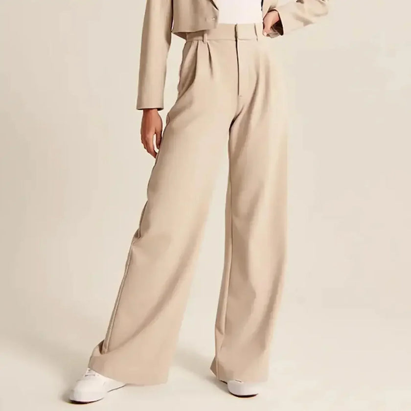 White wide-leg high-waist pants for women by FJØRNA, featuring a relaxed fit and elegant high-rise design.