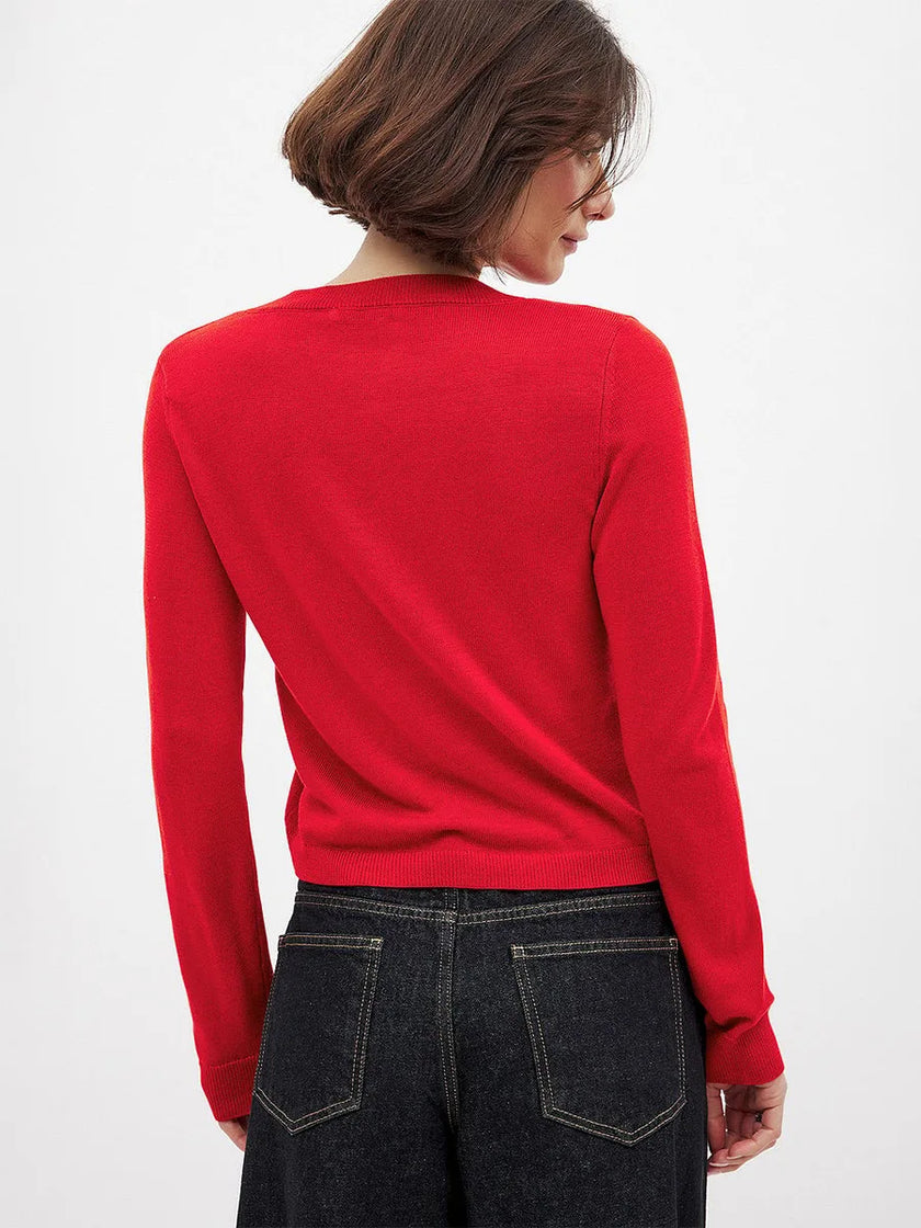FJØRNA longline women's knit cardigan with button-front design, featuring a cozy, stylish top for casual or layered wear.