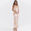 FJØRNA satin floral pencil maxi dress in white with a fitted silhouette and floral pattern, stylish and elegant for special occasions.