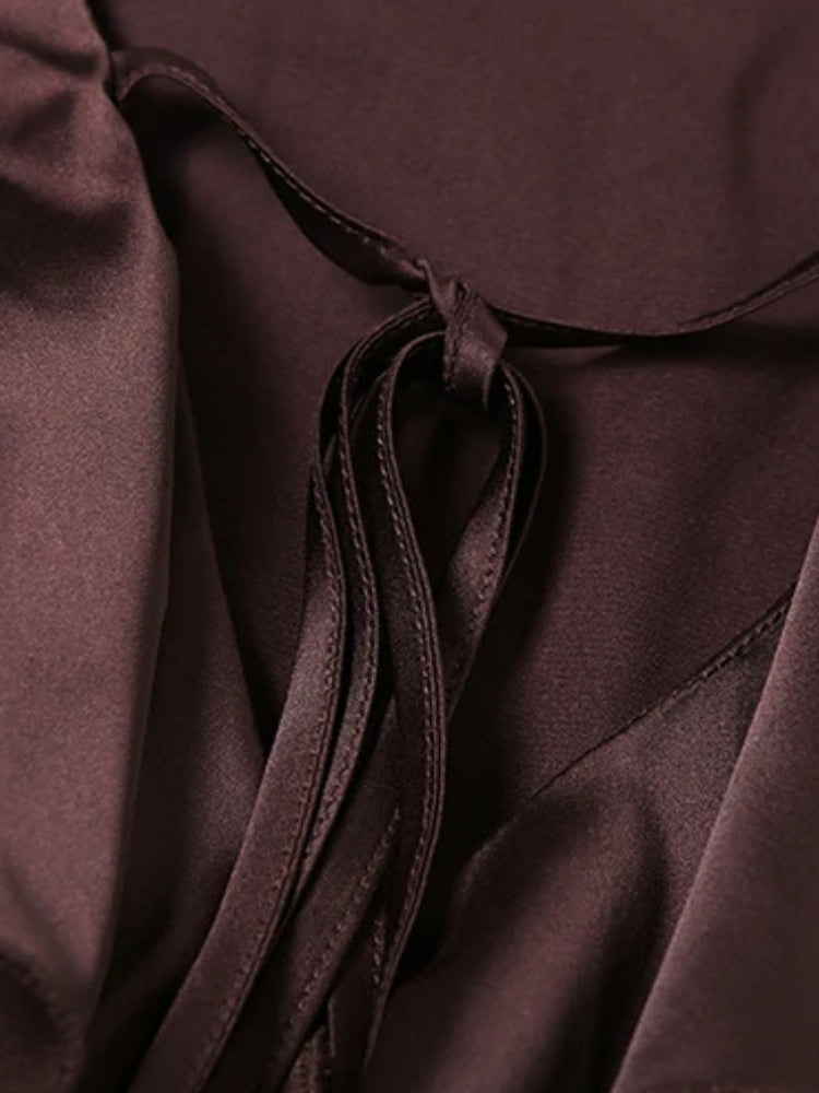 FJØRNA satin ruffled women's mini dress with a fitted bodice and flared hem, perfect for party or cocktail occasions.