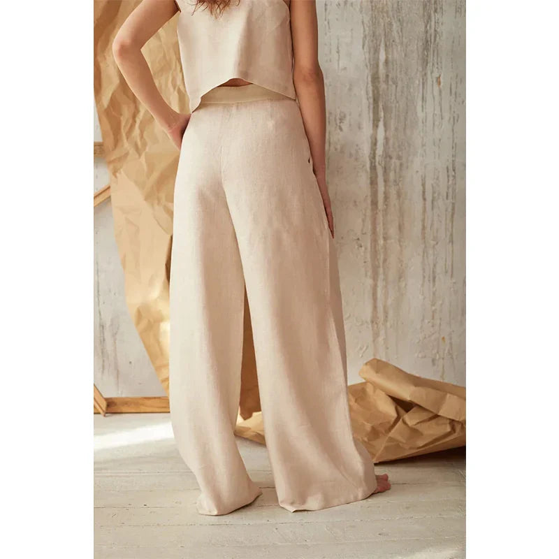 FJØRNA knit wide-leg trousers for women, loose pull-on pants with a relaxed fit and comfortable fabric, displayed on a model.