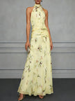 FJØRNA Jasmine floral halter wedding guest dress with a flowy silhouette and delicate floral print, perfect for special occasions.