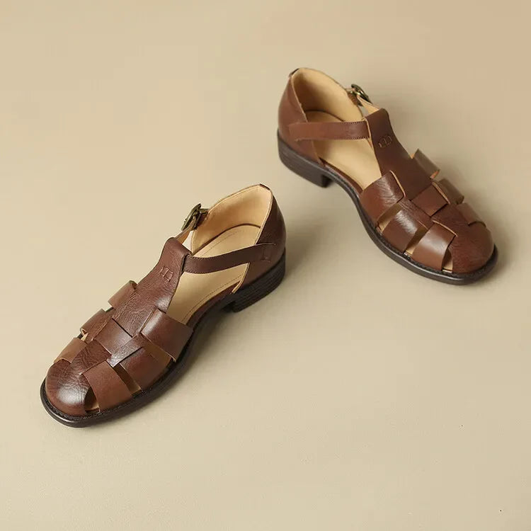 FJØRNA brown Italian leather women's adjustable strap sandals with open toe and flat sole, stylish and comfortable for warm weather.