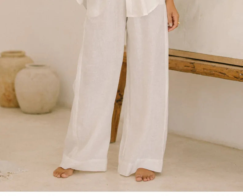 FJØRNA linen wide-leg trousers for women, loose pull-on pants with a relaxed fit and natural fabric appearance.