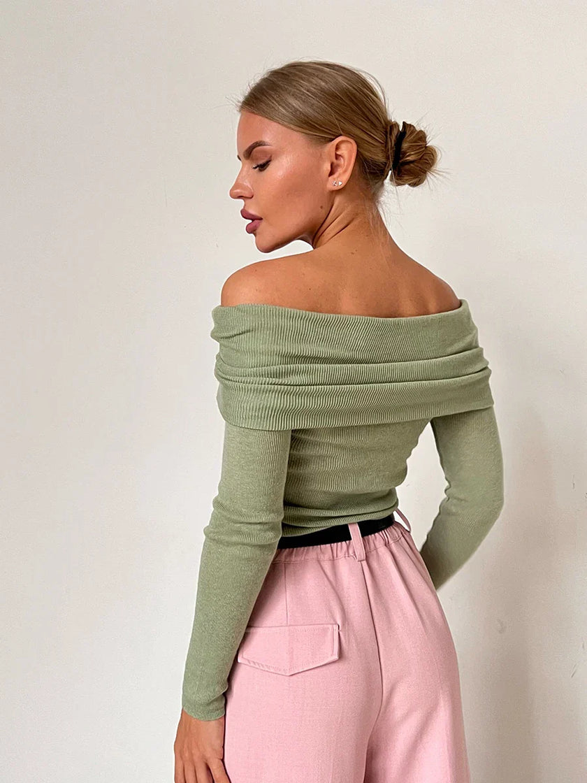 FJØRNA ribbed knit off-shoulder women's top with mock neck, stylish and fitted, shown on a model.