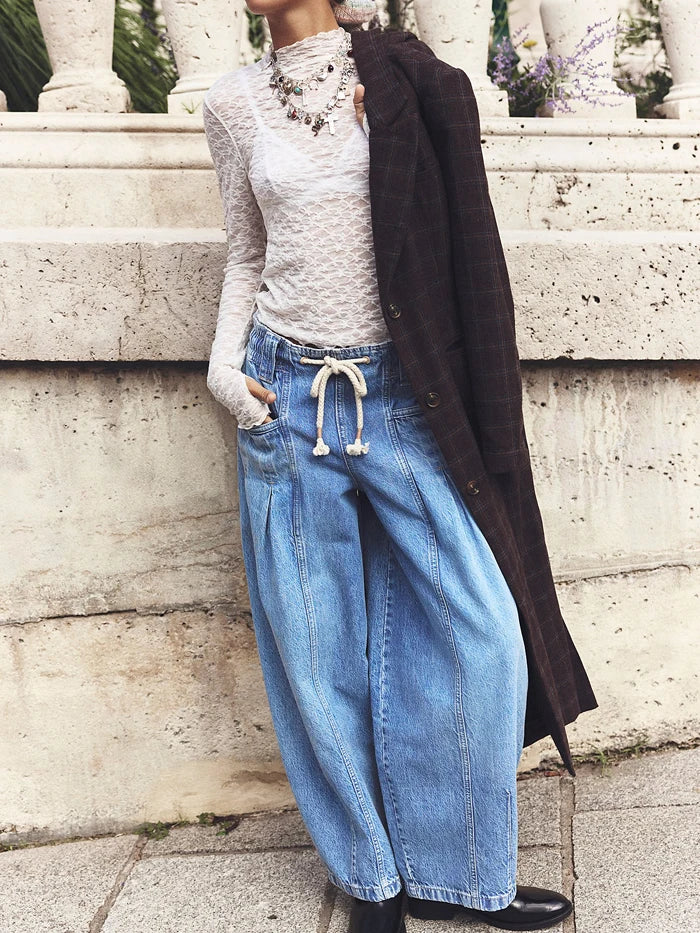 Women’s cotton wide leg jeans with drawstring waist by FJØRNA, featuring a relaxed fit and casual style.