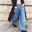 Women’s wide-leg cotton jeans with drawstring waist by FJØRNA, featuring relaxed fit and casual style.