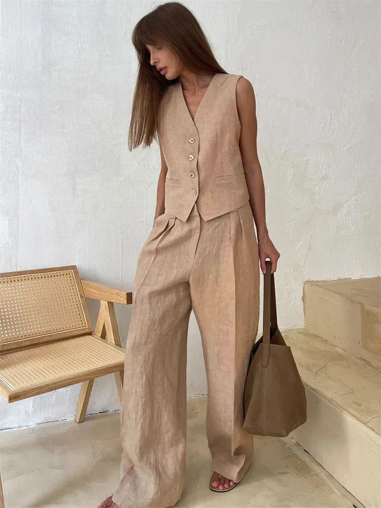FJØRNA women's linen wide-leg trousers, stylish and comfortable pants for women, part of a co-ord set, shown in neutral fabric.